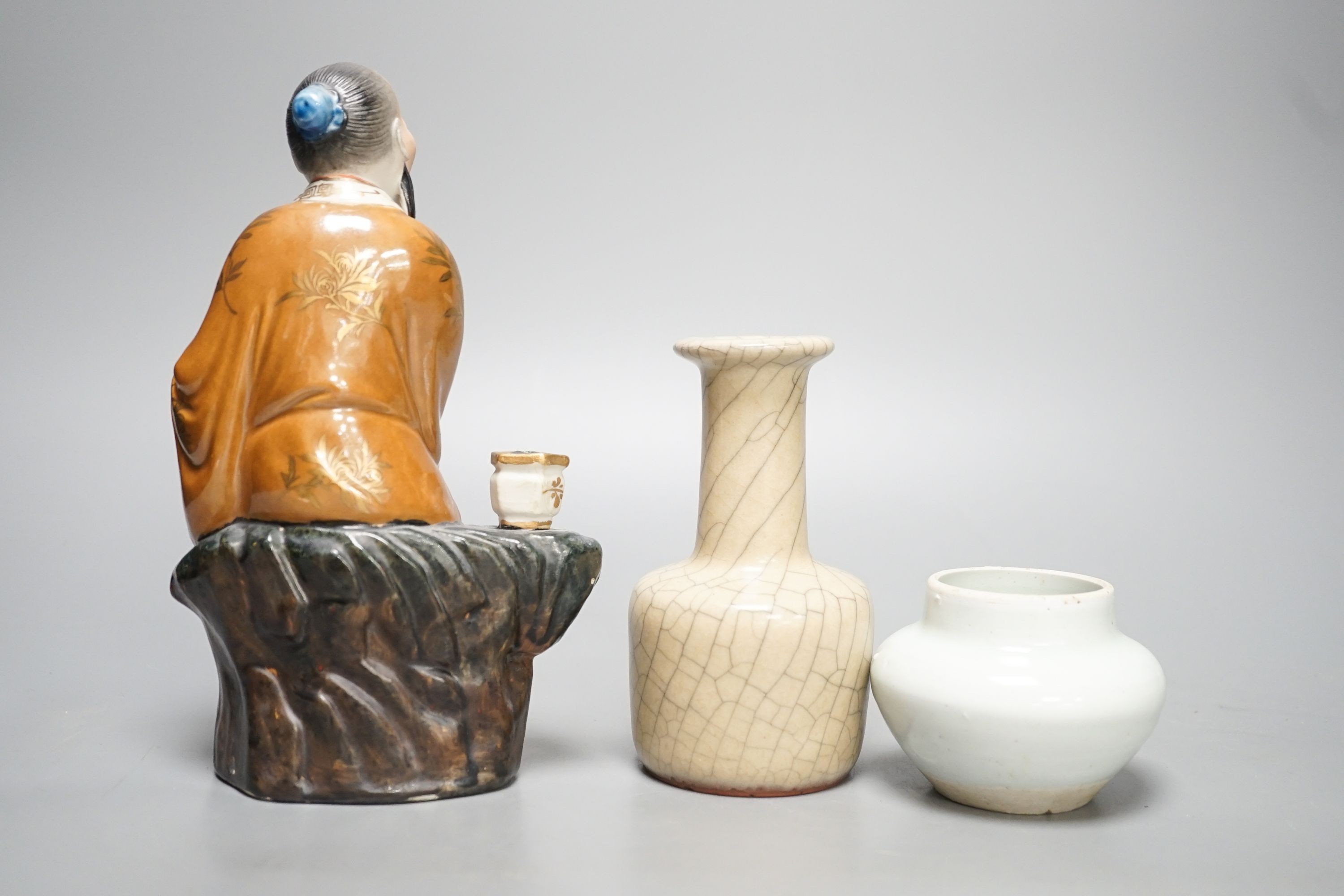 A Chinese porcelain figure, a crackleware jar and a monochrome water pot 20cm